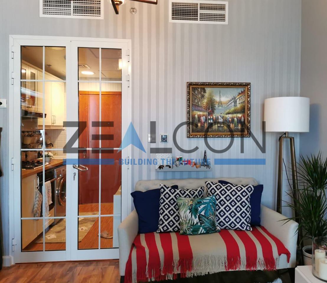 Aluminium Doors 8 White French style aluminium doors with grid glazing in a living room - Zealcon