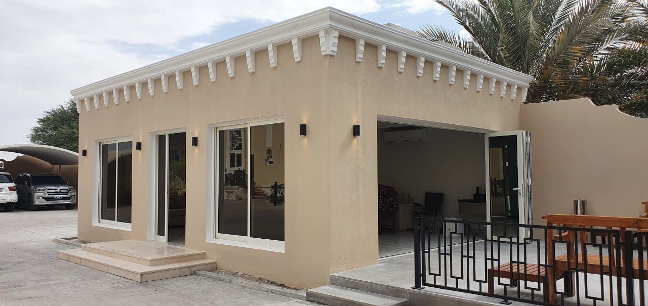 Aluminium Windows 2 White aluminium windows and glazed doors on a villa garden annex - Zealcon