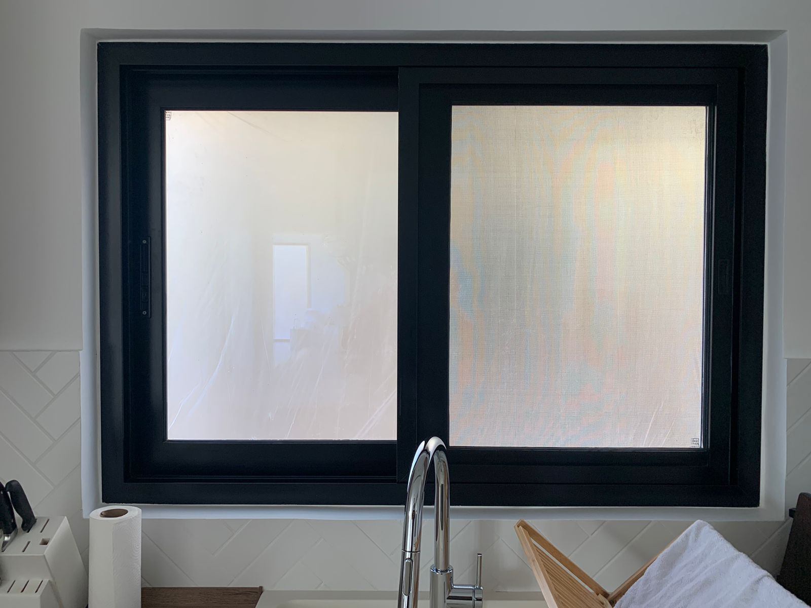 Aluminium Windows 9 Black aluminium sliding window with frosted film above a kitchen sink - Zealcon