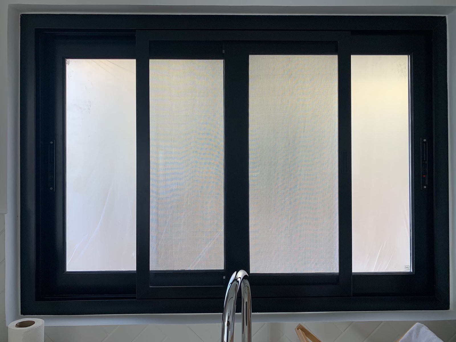 Sharjah 11 Four-panel black aluminium sliding window with frosted glass - Zealcon