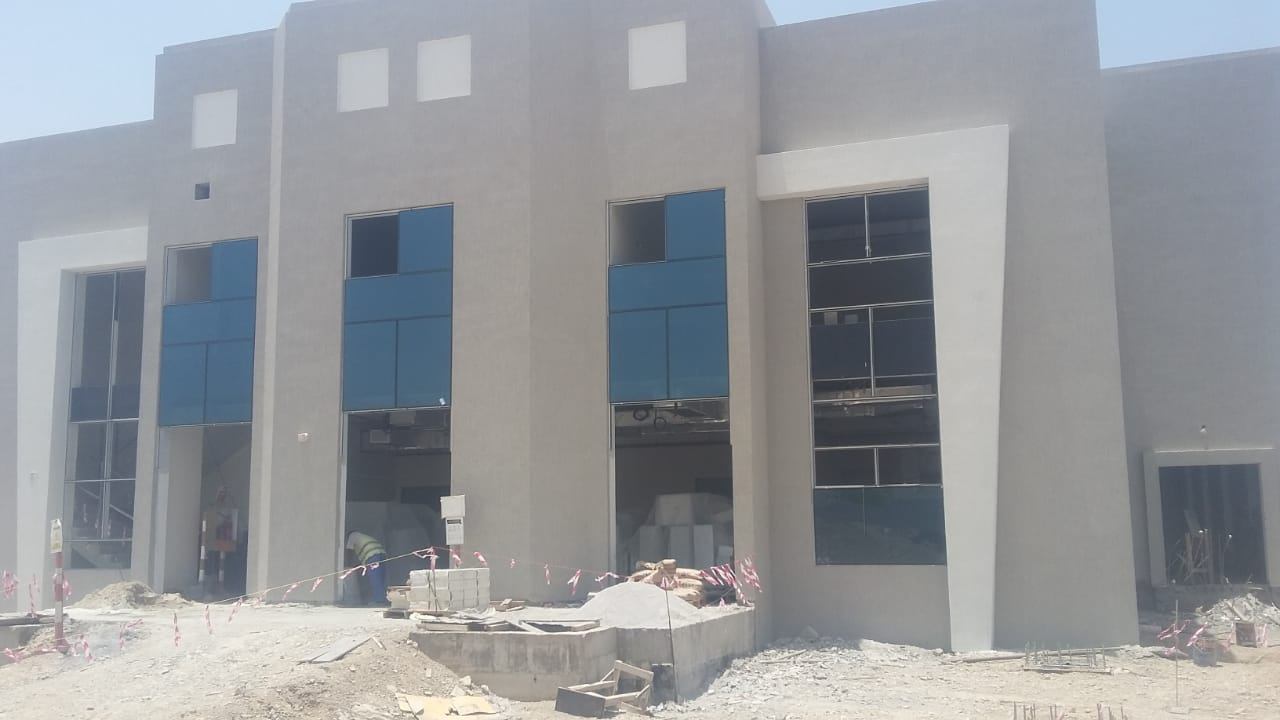 ACP Cladding 4 Entrance glazing in progress with blue tinted units - Zealcon