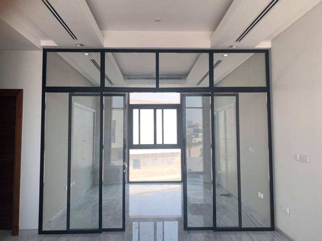 Abu Dhabi 8 Slim black framed glass partition with double doors in an office - Zealcon