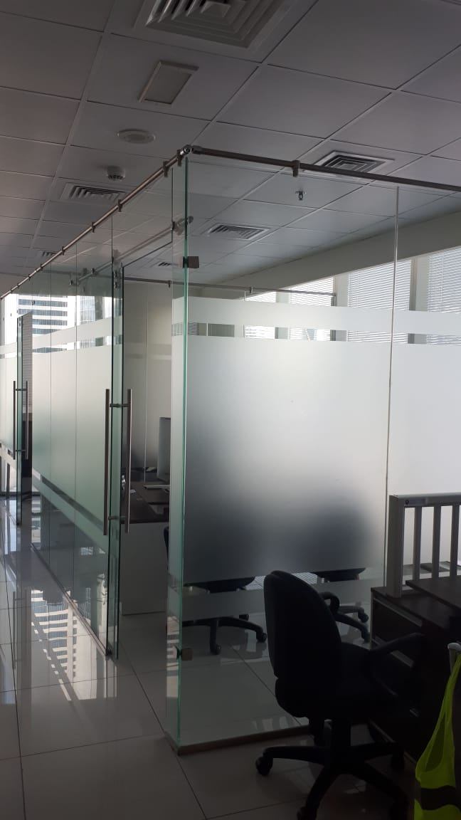 Abu Dhabi 9 Frameless glass office partition with a frosted privacy band - Zealcon