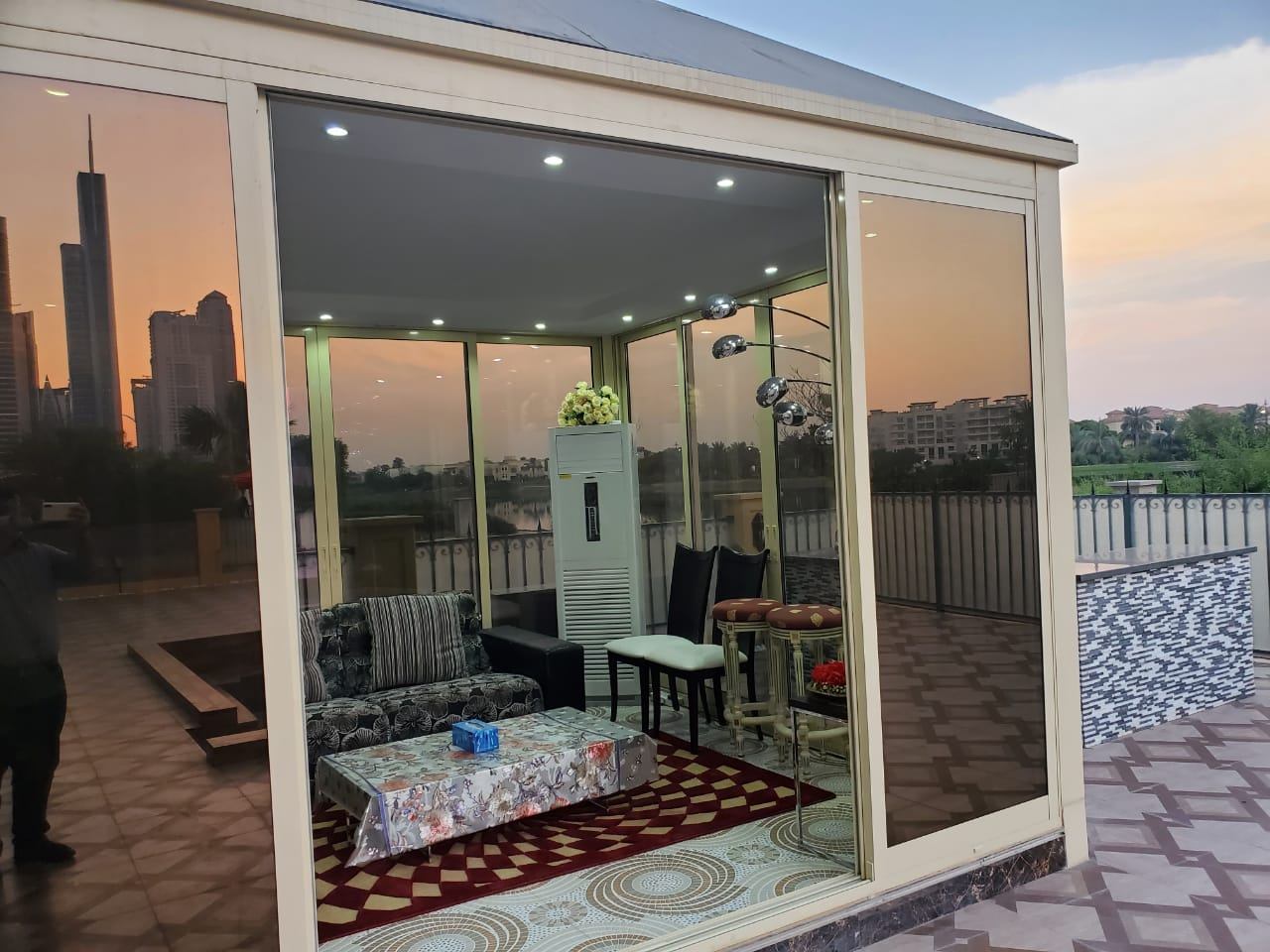 Ras Al Khaimah 10 Glass terrace room with golden frame and skyline view - Zealcon