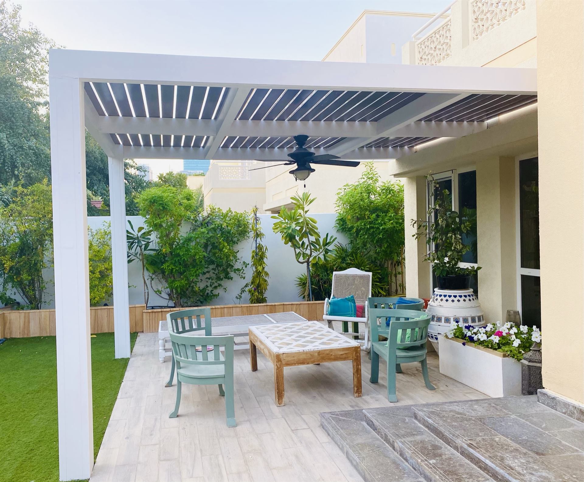 Abu Dhabi 14 Slatted roof aluminium pergola over a garden seating area - Zealcon