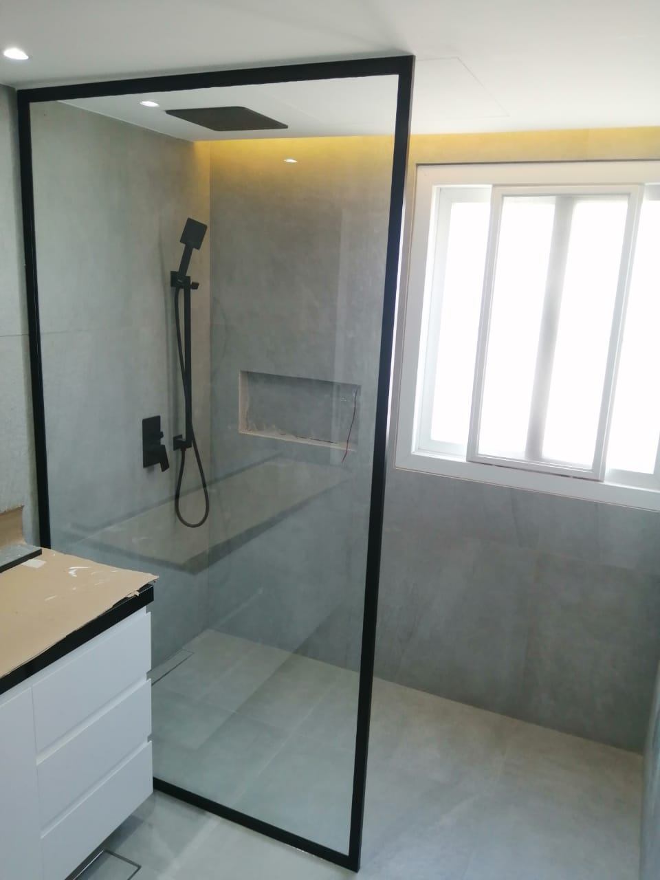 Shower Glass 8 Black framed walk-in shower screen with rain shower in a modern bathroom - Zealcon
