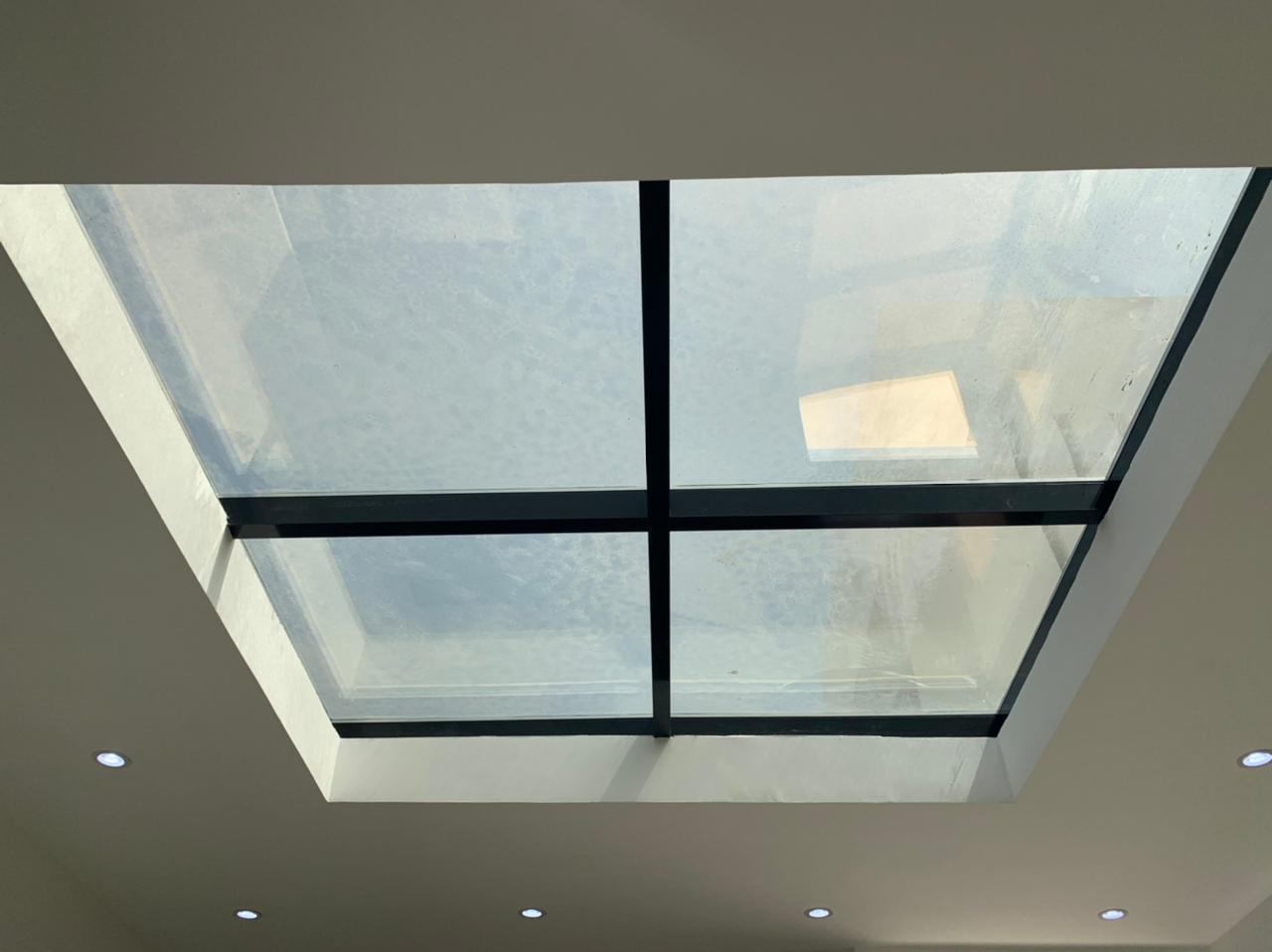 Glass Skylights 8 Four pane skylight with black cross frame in a ceiling - Zealcon
