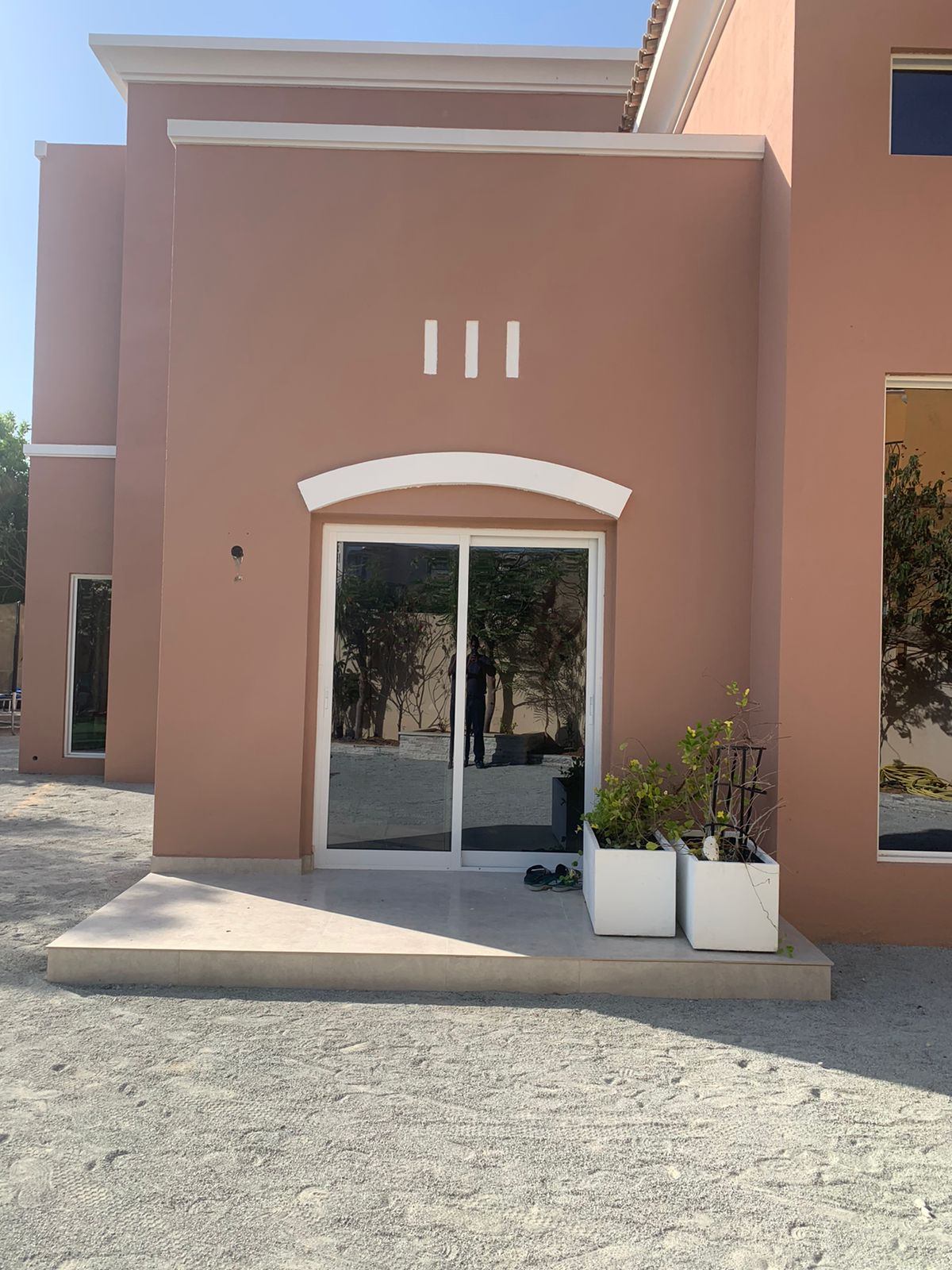 White framed sliding door at a villa terrace entrance - Zealcon
