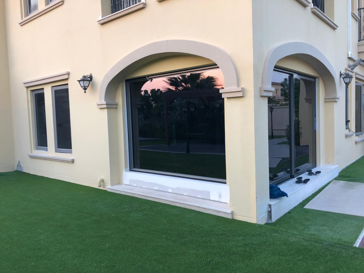 Aluminium Windows 4 Large sliding window in an arched villa opening - Zealcon