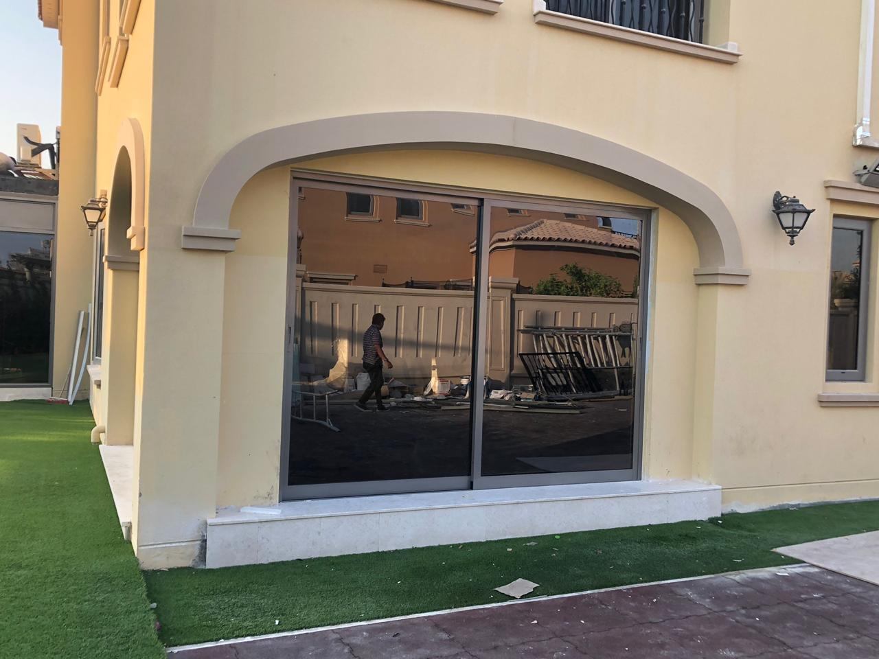 Aluminium Windows 7 Two panel sliding window in an arched stone surround - Zealcon